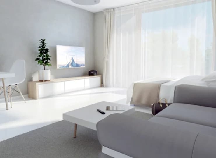 Jest tu łóżko, sofa, aneks kuchenny, stolik, balkon i łazienka