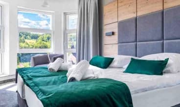 Apartamenty Anmago & Spa położone w Krynicy, w dzielnicy Słotwiny