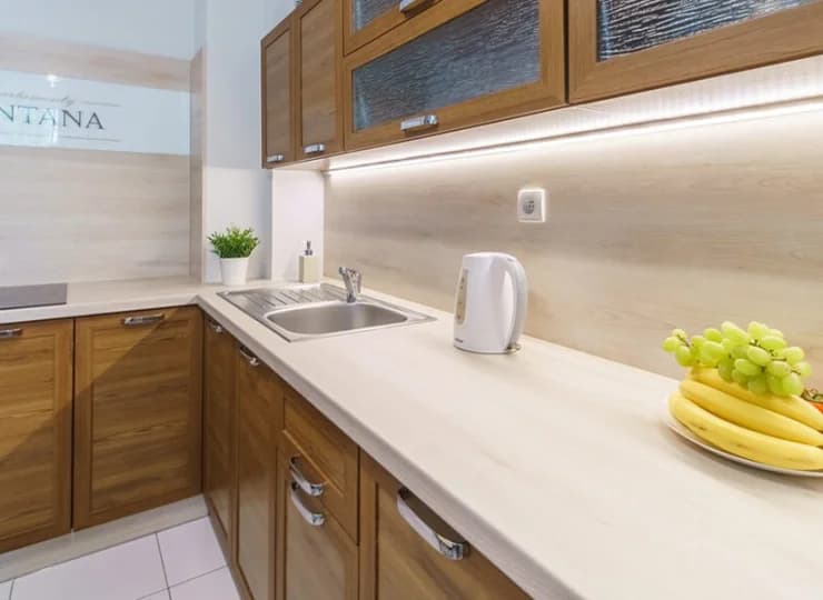 Każdy apartament posiada w pełni wyposażony nowoczesny aneks kuchenny