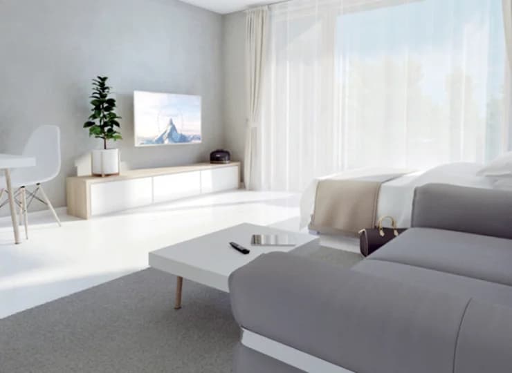 Jest tu łóżko, sofa, aneks kuchenny, stolik, balkon i łazienka