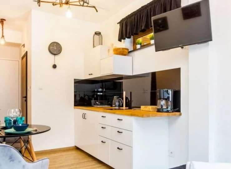 Każdy apartament posiada aneks kuchenny i stół