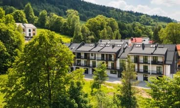 Apartamenty Pod Stokiem mieszczą się u stóp góry Skrzyczne