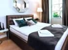 Sypialnia apartamentu 2+2 z sauną i tarasem