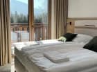 Niektóre pokoje mają balkon z widokiem na Tatry