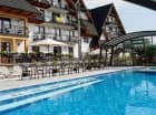 Hotel udostępnia zewnętrzny basen z podgrzewaną wodą i atrakcjami wodnymi