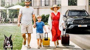 Family with luxury hotel and Mercedes car
